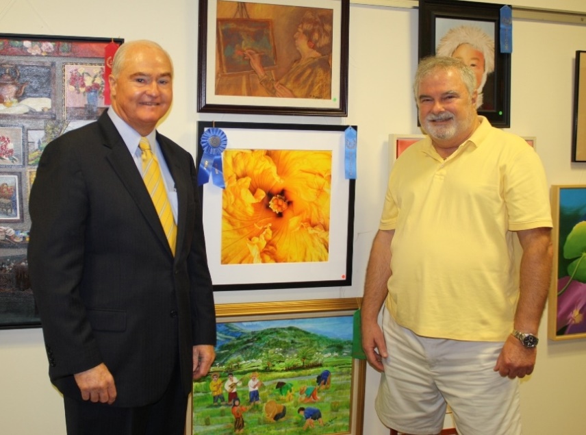 Freeholder John P. Curley congratulates Vince Matulewich of Morganville for winning Best in Show in the professional category for his photograph “Yellow Hibiscus” at the 2014 Monmouth County Senior Citizen Juried Art Contest & Exhibition on August 13, 2014 at the County Library Headquarters in Manalapan, NJ.